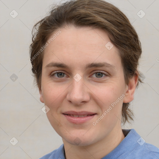 Joyful white young-adult female with medium  brown hair and blue eyes