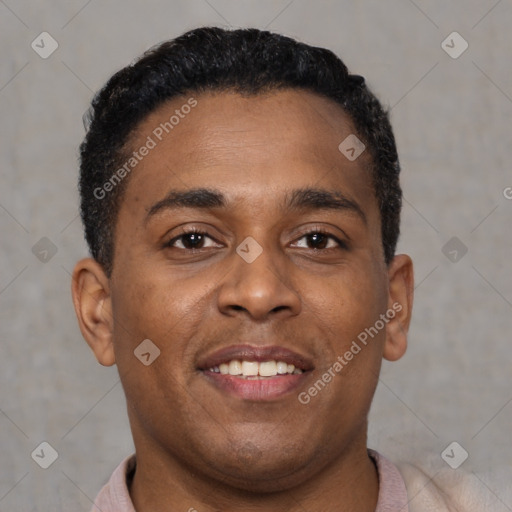 Joyful black young-adult male with short  brown hair and brown eyes