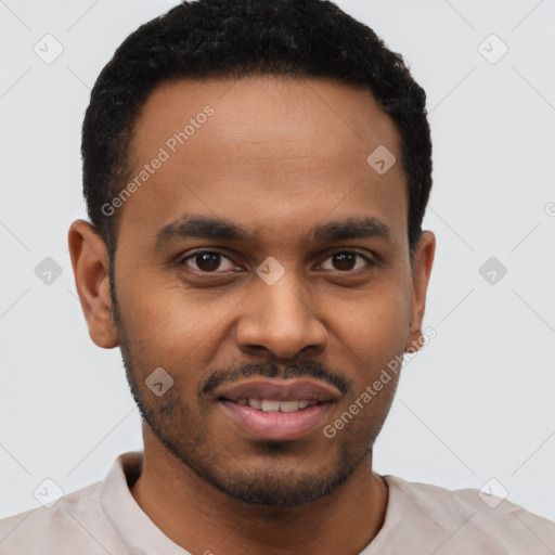 Joyful black young-adult male with short  brown hair and brown eyes