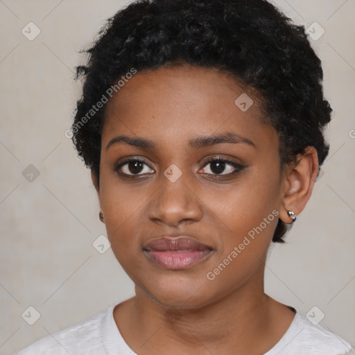 Joyful black young-adult female with short  black hair and brown eyes