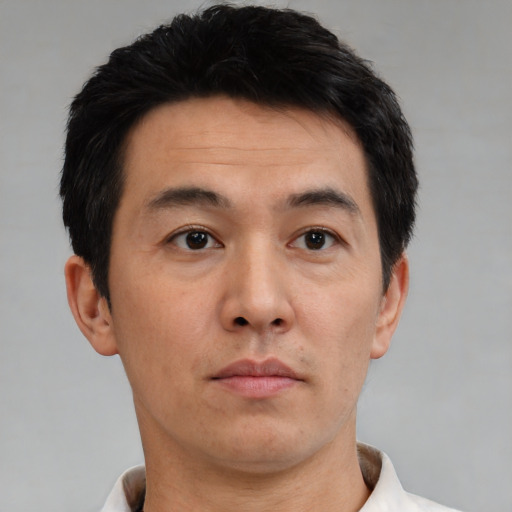 Neutral asian adult male with short  brown hair and brown eyes