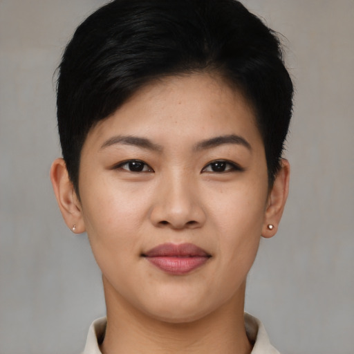 Joyful asian young-adult female with short  black hair and brown eyes