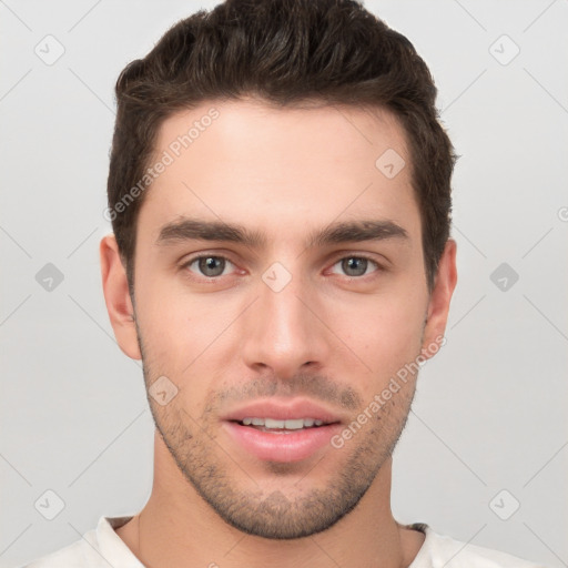 Joyful white young-adult male with short  brown hair and brown eyes