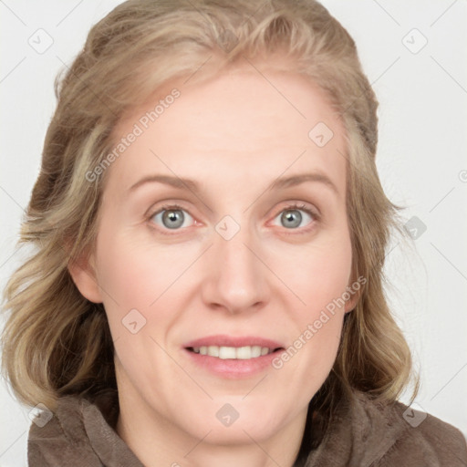 Joyful white adult female with medium  brown hair and blue eyes