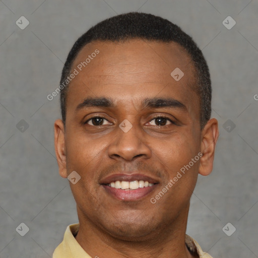 Joyful black young-adult male with short  black hair and brown eyes