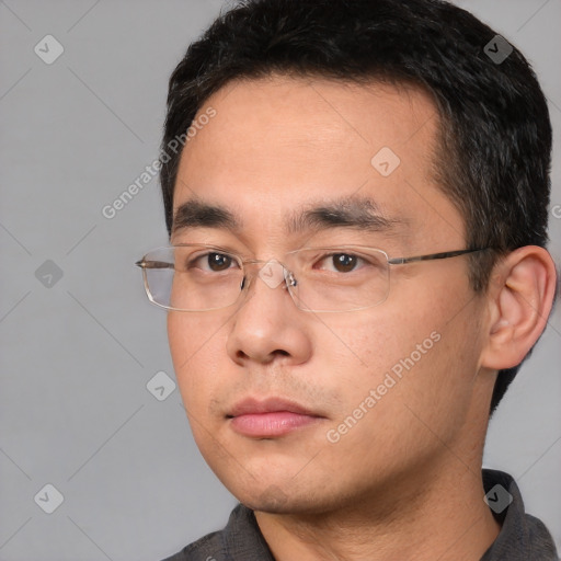 Neutral white young-adult male with short  black hair and brown eyes