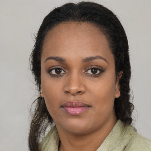 Neutral black young-adult female with long  brown hair and brown eyes