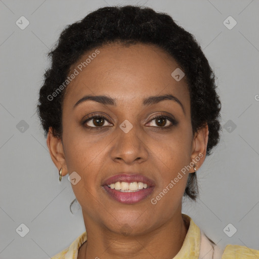 Joyful black young-adult female with short  brown hair and brown eyes