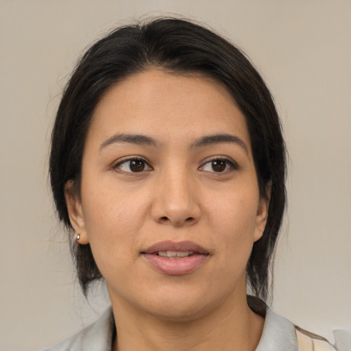 Joyful asian young-adult female with medium  brown hair and brown eyes