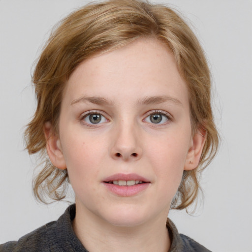 Joyful white young-adult female with medium  brown hair and blue eyes