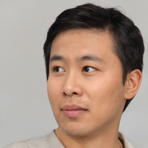 Neutral asian young-adult male with short  black hair and brown eyes