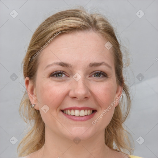 Joyful white young-adult female with medium  brown hair and blue eyes