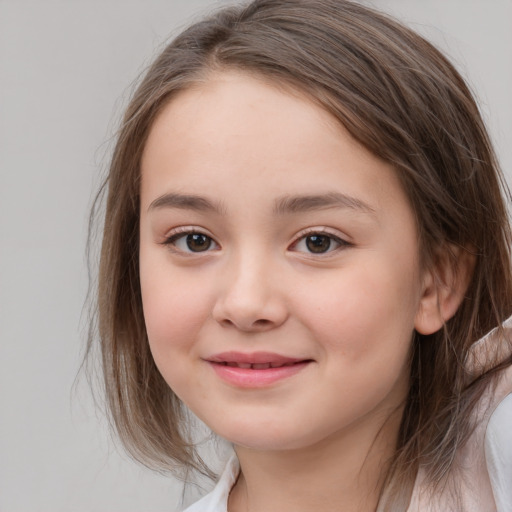 Joyful white child female with medium  brown hair and brown eyes