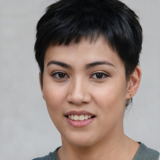 Joyful white young-adult female with short  black hair and brown eyes