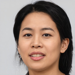 Joyful asian young-adult female with medium  black hair and brown eyes