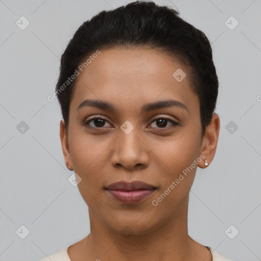 Joyful latino young-adult female with short  black hair and brown eyes