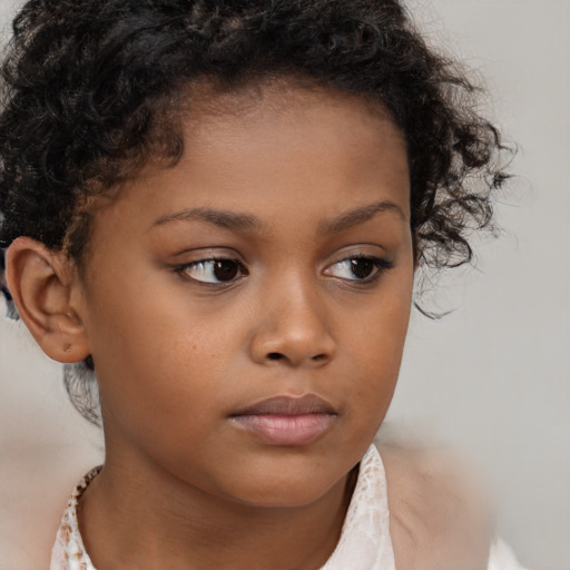 Neutral black child female with short  brown hair and brown eyes