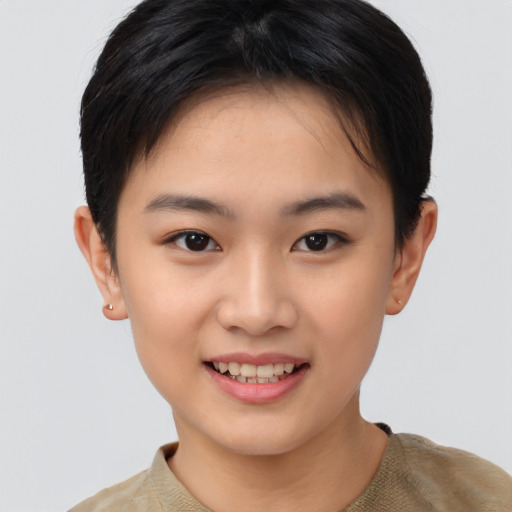 Joyful asian young-adult female with short  brown hair and brown eyes