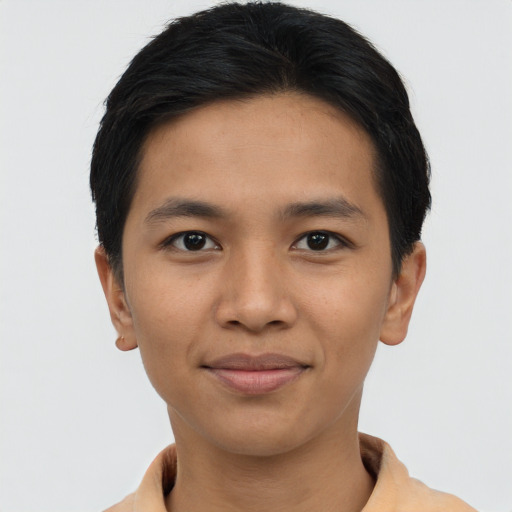 Joyful asian young-adult male with short  brown hair and brown eyes