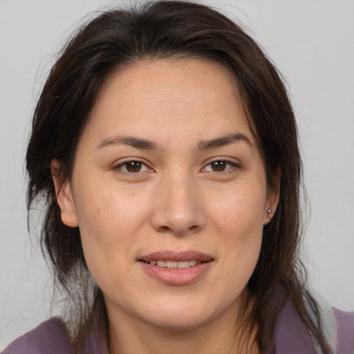 Joyful white adult female with medium  brown hair and brown eyes