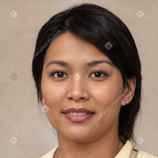 Joyful latino young-adult female with medium  brown hair and brown eyes