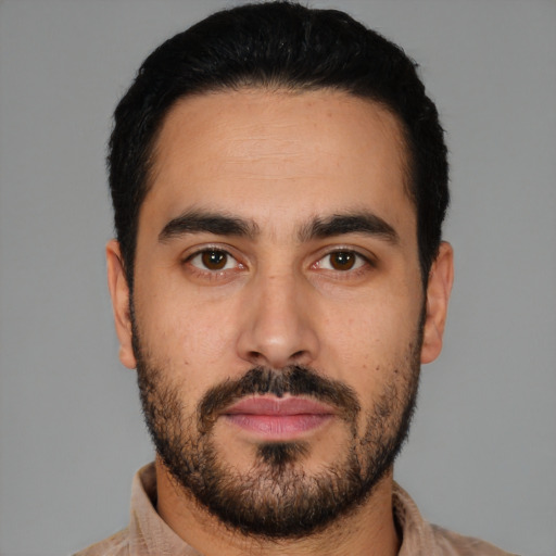 Neutral latino young-adult male with short  black hair and brown eyes