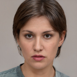 Neutral white young-adult female with medium  brown hair and brown eyes