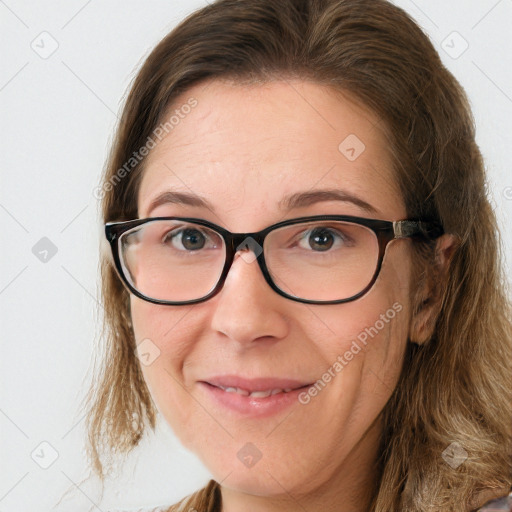 Joyful white adult female with medium  brown hair and blue eyes