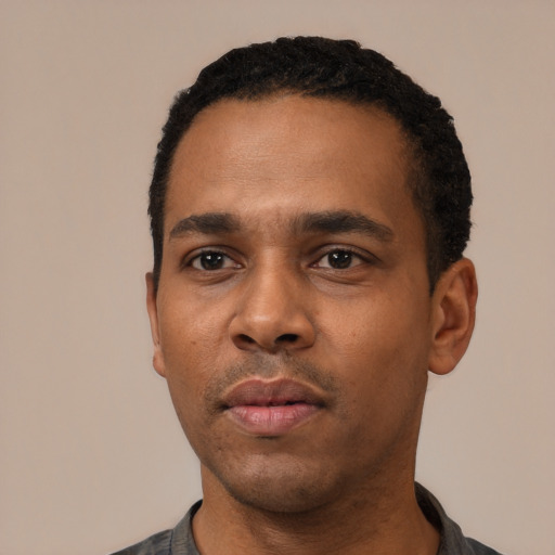 Neutral black young-adult male with short  black hair and brown eyes