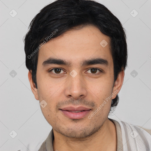 Joyful white young-adult male with short  black hair and brown eyes