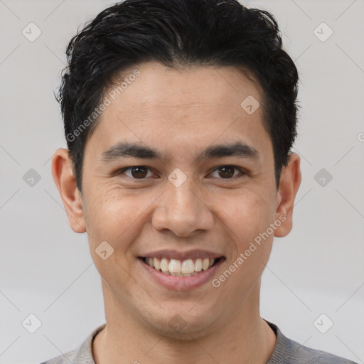 Joyful latino young-adult male with short  brown hair and brown eyes