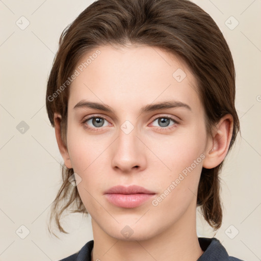 Neutral white young-adult female with medium  brown hair and grey eyes