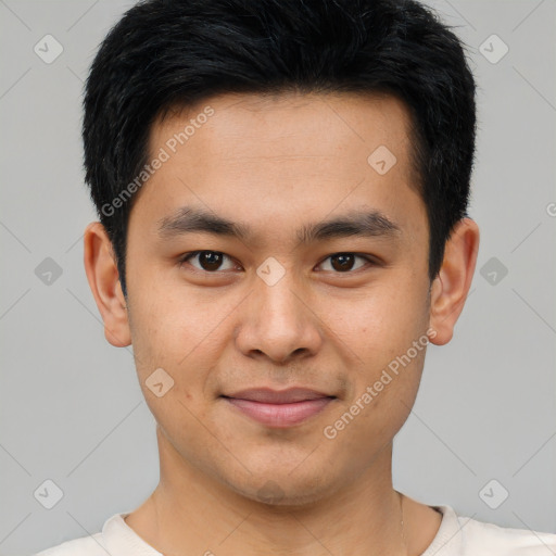 Joyful asian young-adult male with short  brown hair and brown eyes