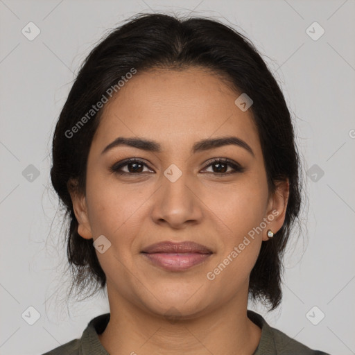 Joyful latino young-adult female with medium  brown hair and brown eyes