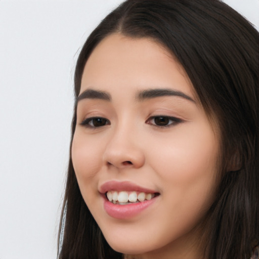 Joyful white young-adult female with long  black hair and brown eyes