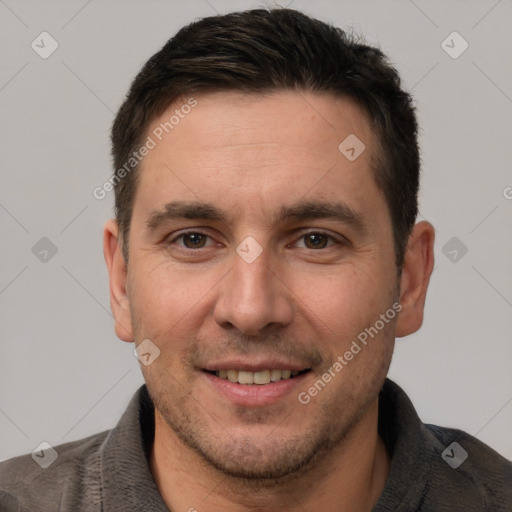 Joyful white adult male with short  brown hair and brown eyes