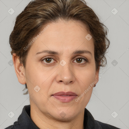 Joyful white adult female with short  brown hair and brown eyes