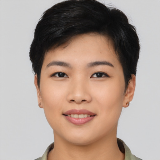 Joyful asian young-adult female with short  black hair and brown eyes