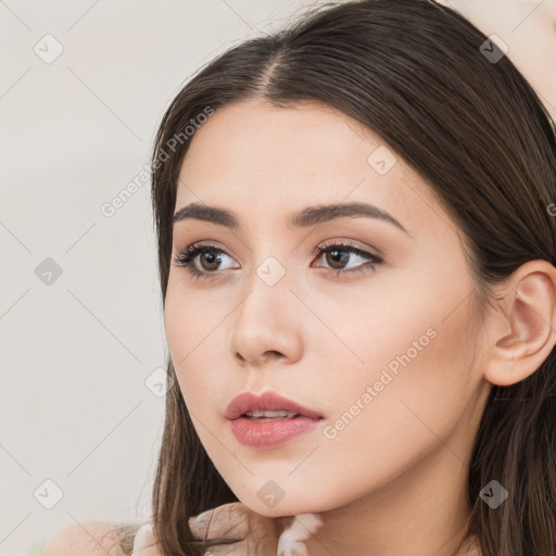 Neutral white young-adult female with long  brown hair and brown eyes