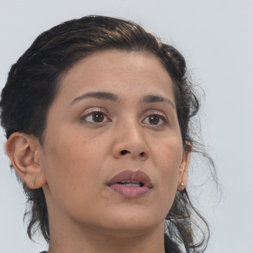 Neutral asian adult female with medium  brown hair and brown eyes