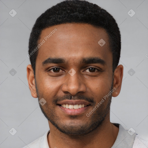 Joyful black young-adult male with short  black hair and brown eyes