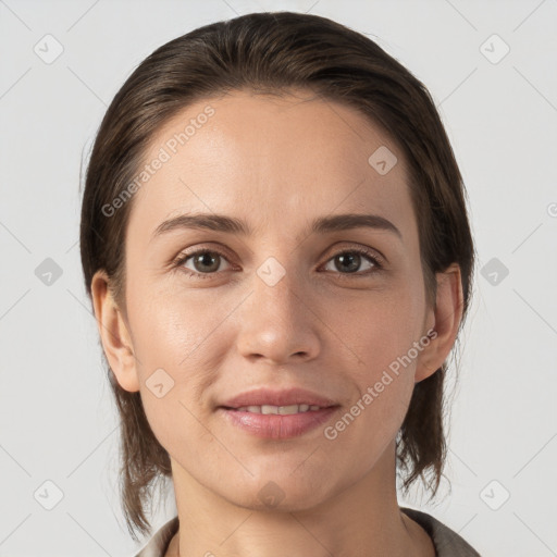 Joyful white young-adult female with medium  brown hair and brown eyes