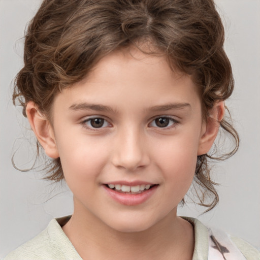 Joyful white child female with medium  brown hair and brown eyes