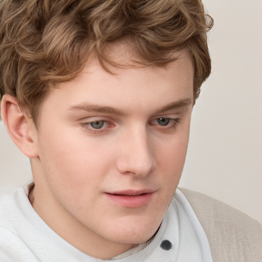 Joyful white child male with short  brown hair and brown eyes