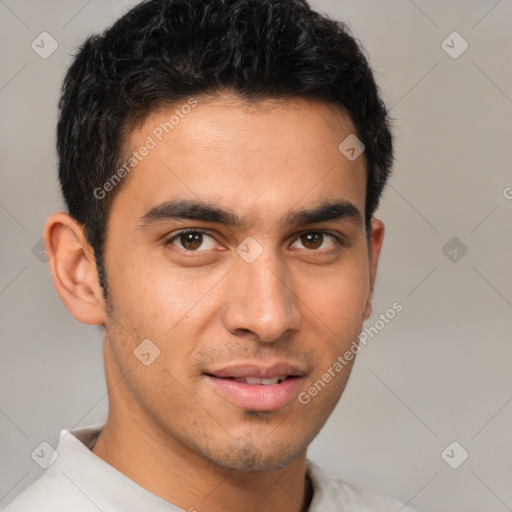 Joyful latino young-adult male with short  brown hair and brown eyes