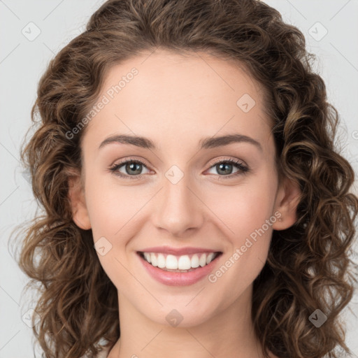 Joyful white young-adult female with long  brown hair and green eyes