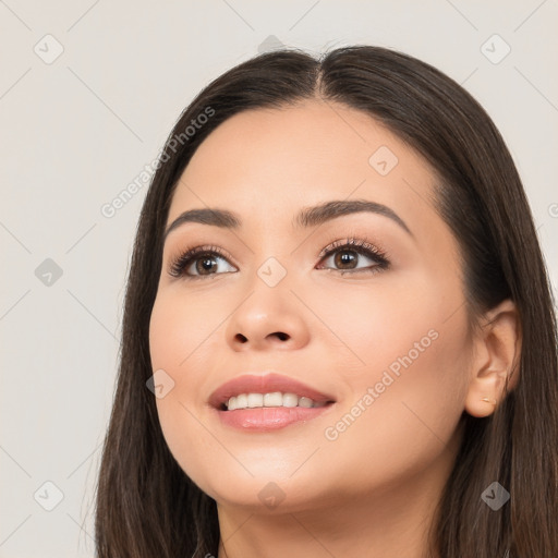 Joyful white young-adult female with long  black hair and brown eyes