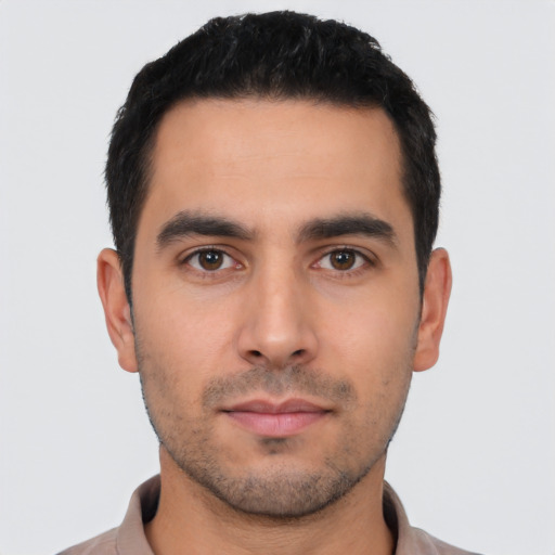 Neutral latino young-adult male with short  black hair and brown eyes