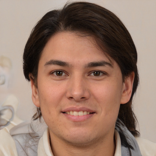 Joyful white young-adult male with medium  brown hair and brown eyes