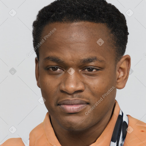 Joyful latino young-adult male with short  brown hair and brown eyes